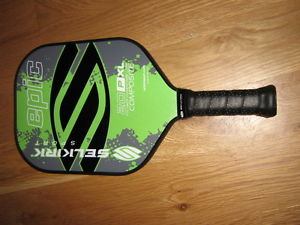 A brand new unused Selkirk Sport pickleball paddle Omni graphite green