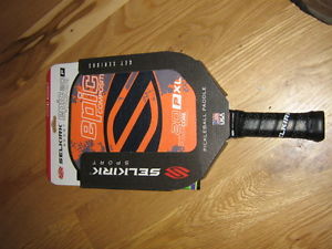 A brand new unused Selkirk Sport pickleball paddle Epic 20 P XL composite orange